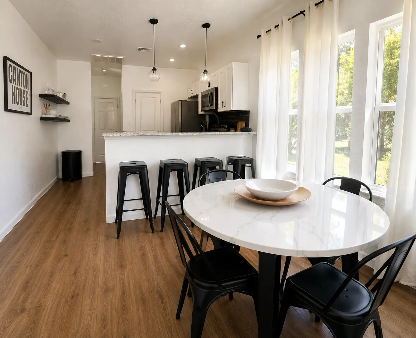 Round dining table beside the kitchen
