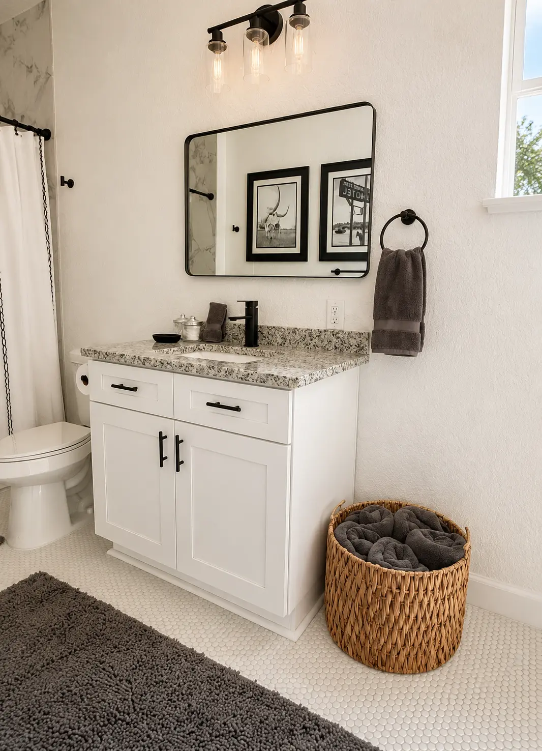 Primary bathroom vanity and round mirror