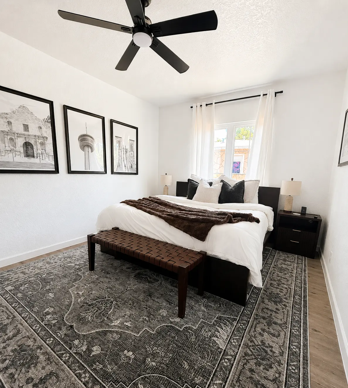 Primary bedroom with a king bed and vintage-inspired rug