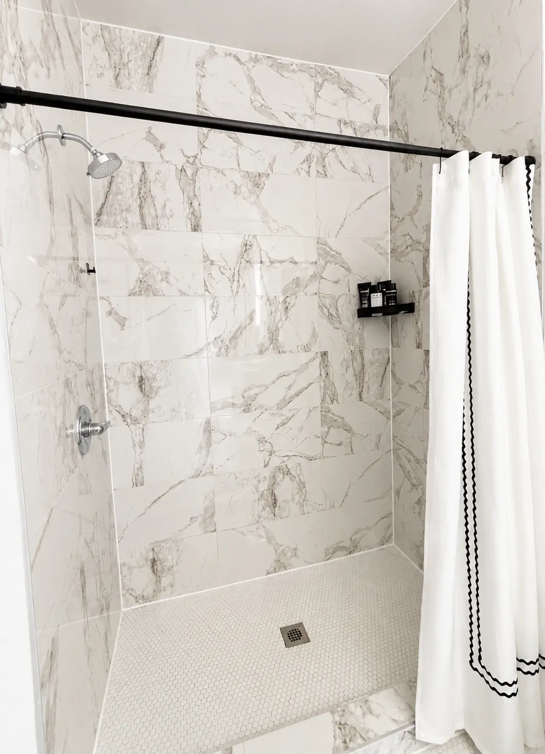 Marble-look tiled walk-in shower